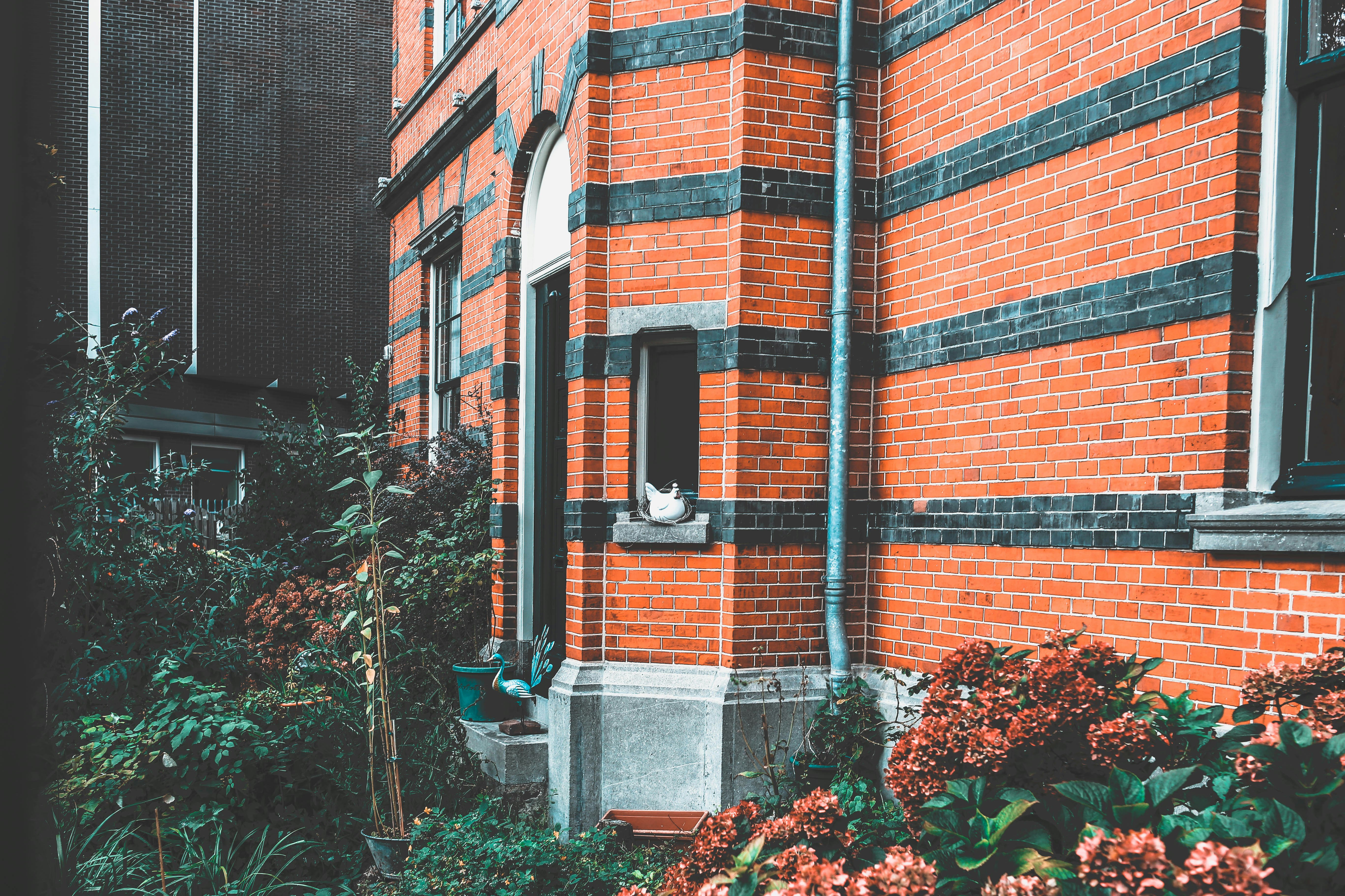 red and black brick house during daytime